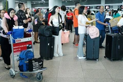 Air passengers at the departure terminal of the Phnom Penh International Airport. (Photo: khmertimeskh.com)