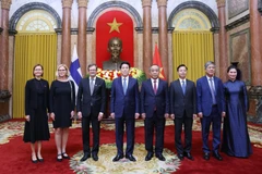 State President Luong Cuong (fourth from left) receives Finnish Ambassador Pekka Voutilainen (third from left). (Photo: VNA)