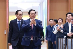 Prime Minister Pham Minh Chinh attends the national conference reviewing the implementation of Resolution No. 36-NQ/TW on OV affairs and guiding documents of the Party Central Committee's Politburo and Secretariat in this field (Photo: VNA) 