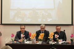 Vietnamese Ambassador to Russia Dang Minh Khoi (L) and other speakers at a plenary session of the international conference on Vietnam. (Photo: VNA)