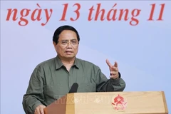 Prime Minister Pham Minh Chinh speaks at the November 13 meeting with leaders of ministries and central-level agencies, which is connected online with disaster-affected localities. (Photo: VNA)