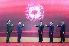 Delegates launch mobile application on information and education, and mass mobilisation affairs (TGDV) (Photo: VNA)