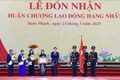 State President Luong Cuong awards the first-class Labour Order to Binh Phuoc (Photo: VNA)