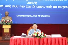 Lao Deputy Prime Minister and Chairman of the Laos–Vietnam Cooperation Committee Saleumxay Kommasith speaks at the conference. (Photo: VNA)