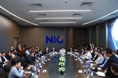 Deputy Prime Minister Nguyen Chi Dung (centre), officials of the Ministry of Finance and the Ministry of Science and Technology, representatives of research institutes and universities, and nearly 70 experts from 22 countries attend the event. (Photo: National Innovation Centre)