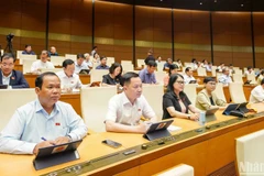 Deputies participate in 15th National Assembly’s ongoing 9th session (Photo: nhandan.vn)