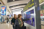 Foreign tourists at Noi Bai International Airport. (Photo: VNA)