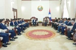 Senior executives from the Vietnam National Chemical Group (Vinachem) report on the progress of a major potash mining and processing project in Khammouane province to Lao Deputy Prime Minister Saleumxay Kommasith, May 27. (Photo: Vinachem)