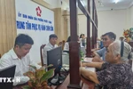 A large number of residents come to the public service centre of Phuoc Thang ward, Ho Chi Minh City, on the first day of official operations under the newly established two-tier local government system to complete administrative procedures. (Photo: VNA) 