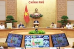 Prime Minister Pham Minh Chinh chairs the regular June cabinet meeting and the national online conference between the Government and local authorities. (Photo: VNA)