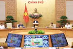 Prime Minister Pham Minh Chinh chairs the regular June cabinet meeting and the national online conference between the Government and local authorities. (Photo: VNA)