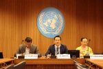 Ambassador Mai Phan Dung, Head of the Permanent Mission of Vietnam to Geneva (C), speaks at the discussion session. (Photo: VNA)