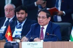 Prime Minister Pham Minh Chinh delivers his remarks at the high-level discussion on “Strengthening Multilateralism, Economic–Financial Issues, and Artificial Intelligence” at the expanded BRICS summit 2025. (Photo: VNA)