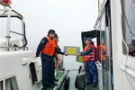 The Vietnam and China Coast Guards conduct a joint patrol in the Gulf of Tonkin. (Photo: VNA)