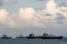 Shipping vessels moored in waters off the southeastern coast of Singapore. (Photo: Blommberg) 
