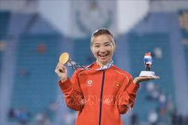 Hoang Thi Oanh brings home her third gold from SEA Games 33 and 15th SEA Games gold overall. (Photo: VNA)