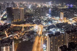 A bird’s-eye view of Phnom Penh by night shows some of the capital’s many tall building projects. (Photo: phnompenhpost.com) 
