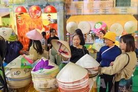 Conical hats from Chuong village are showcased at the “Hanoi Autumn Essence” space of the Autumn Fair 2025. (Photo: VNA)