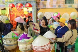 Conical hats from Chuong village are showcased at the “Hanoi Autumn Essence” space of the Autumn Fair 2025. (Photo: VNA)