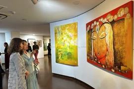 Visitors at the exhibition (Photo: VNA) 