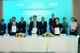 Vietnam Airlines partners with ACB and Visa Inc. to launch Lotusmiles Pay. (Photo courtesy of Vietnam Airlines) 