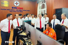Officials visit the smart power grid operations centre of the Con Dao special zone. (Photo: VNA)