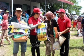 The Lam Dong Red Cross, in coordination with sponsors, delivered 540 essential relief packages to residents severely affected by floods in Ham Thanh commune, Lam Dong province. (Photo: VNA) 