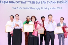 Certificate of merit presented to VIB for supporting housing programme for disadvantaged households in HCM City (Photo: VNA) 