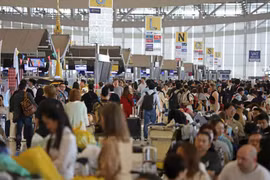 Outbound travellers are pictured at the passenger terminal of Suvarnabhumi airport during the Songkran festival last year. (Photo: Bangkokpost) 
