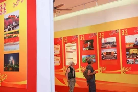 Visitors at an exhibition on the CPV's 95th founding anniversary in Hanoi (Photo: VNA)