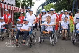 Many persons with disabilities have become inspiring examples of resilience, successfully integrating into the community and earning recognition and respect across all aspects of social life. (Photo: VNA) 