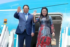 PM Pham Minh Chinh and his spouse (Photo: VNA)