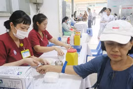 Residents receive health check-ups at Cho Lon Ward Health Station. (Photo: VNA) 