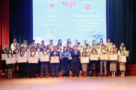 As part of the celebration, 35 Lao students are awarded certificates of merit for academic excellence and active participation in youth activities. (Photo: VNA)