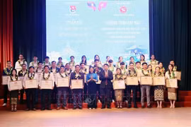 As part of the celebration, 35 Lao students are awarded certificates of merit for academic excellence and active participation in youth activities. (Photo: VNA)