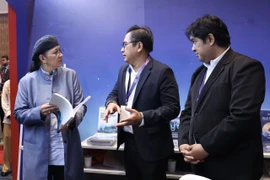 Hanifah (left) visiting the exhibition booths after officiating the ASEAN Blue Economy Forum at the Sabah International Convention Centre (Photo: Bernam). 