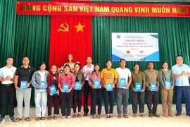 Over 1,000 disadvantaged border residents in Gia Lai receive health insurance cards on November 13. (Photo: VNA)
