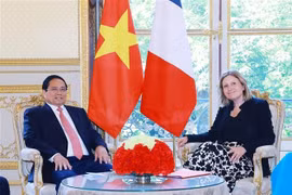Prime Minister Pham Minh Chinh (L) and President of the French National Assembly Yaël Braun-Pivet in Paris on June 10. (Photo: VNA)