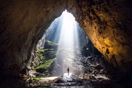 Sunlight streams into the Dinosaur Eye while visitors join the Son Doong adventure tour (Photo: VNA published)