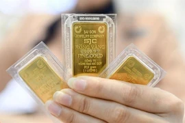SJC gold bars are trading at a record high. (Photo: VNA) 