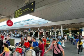 Passengers at Tan Son Nhat International Airport (Photo: VNA)