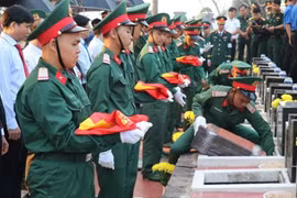 The solemn funeral held for 66 martyrs in Binh Phuoc (Photo: VNA)