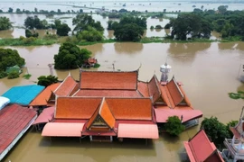 An aerial view of the area surrounding Wat Bot (Bon) in Ban Krathum, Sena district in Ayutthaya, showing extensive recent flooding. The new insurance development plan considers disaster risks. (Photo: bangkokpost.com) 