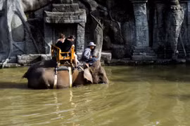 Two tourists ride a Sumatran elephant at Bali Zoo, Gianyar, Bali, June 25, 2018. (Photo: ANTARA)