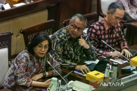 Finance Minister Sri Mulyani Indrawati (left), Bank Indonesia Governor Perry Warjiyo (center), and Chairman of the OJK Board of Commissioners Mahendra Siregar (right) deliver their presentations during a working meeting with Commission XI of the Indonesian House of Representatives (DPR RI) at the Parliamentary Complex in Senayan, Jakarta, Thursday (July 3, 2025). (Photo: Antara)
