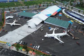 Visitors have a chance to view aircraft from past to present at the exhibition on national achievements. (Photo: VietnamPlus)