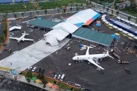 Visitors have a chance to view aircraft from past to present at the exhibition on national achievements. (Photo: VietnamPlus)