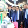 Officials visit a booth at the festival. (Photo: VNA)