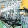 At THACO auto assembling factory (Photo: VNA)