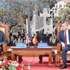 Minister of Finance Ngo Van Tuan (right) and UK's Ambassador to Vietnam Iain Frew at their meeting (Photo: mof.gov.vn)